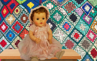 1950's doll against croceted blanket